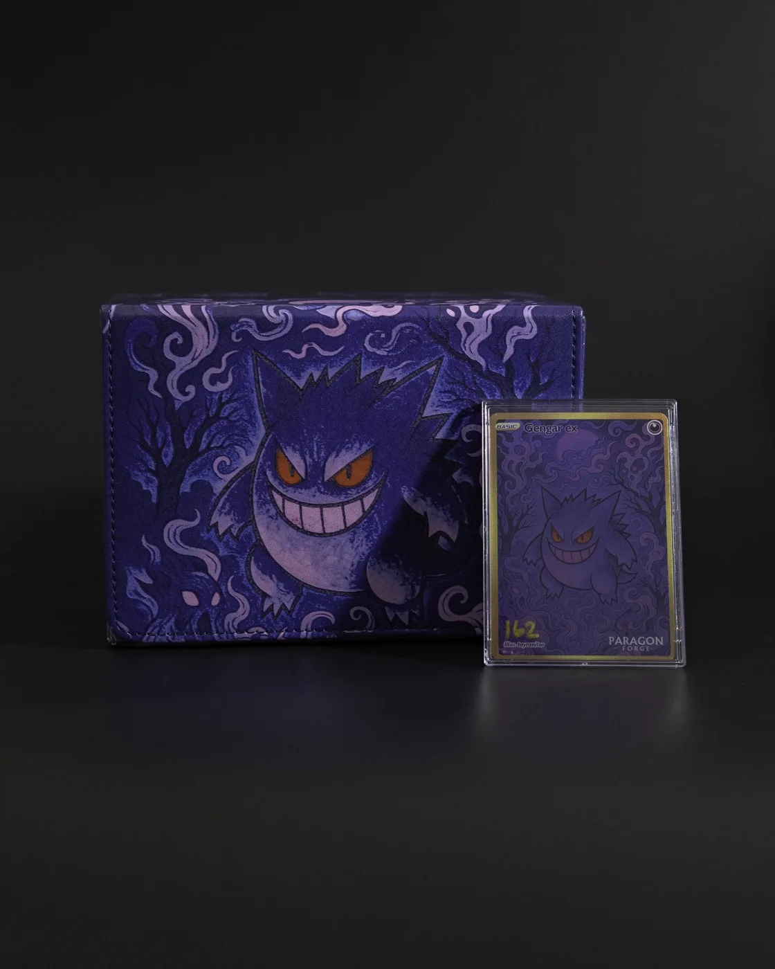 Purple Gengar collectibles and a trading card, photographed by NG Studios